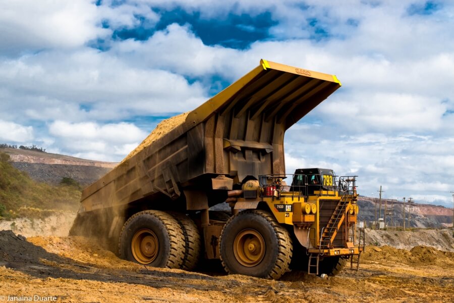 Haul truck tipping next to the waste pile