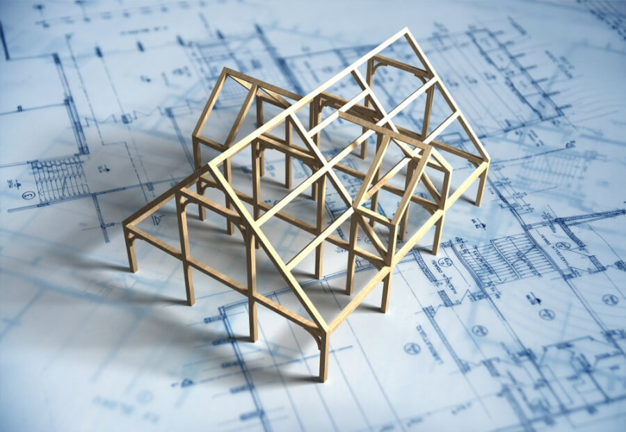Modell eines Hauses steht auf Architektur-Plan
